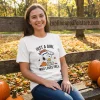 Denver Broncos Snoopy Peanuts Just A Girl Who Loves Fall Graphic T-Shirt
